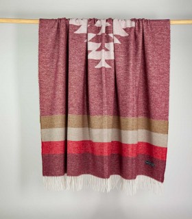 Large blanket Aztec Soft Garnet hanging on a bar