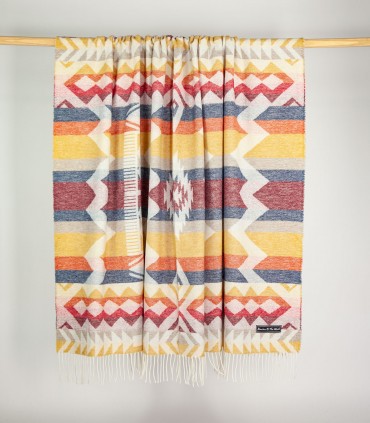 Soft Blanket Inca Yellow hanging on a bar