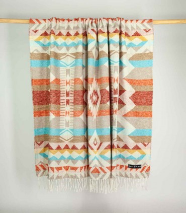 Soft Blanket Inca Red hanging on a bar